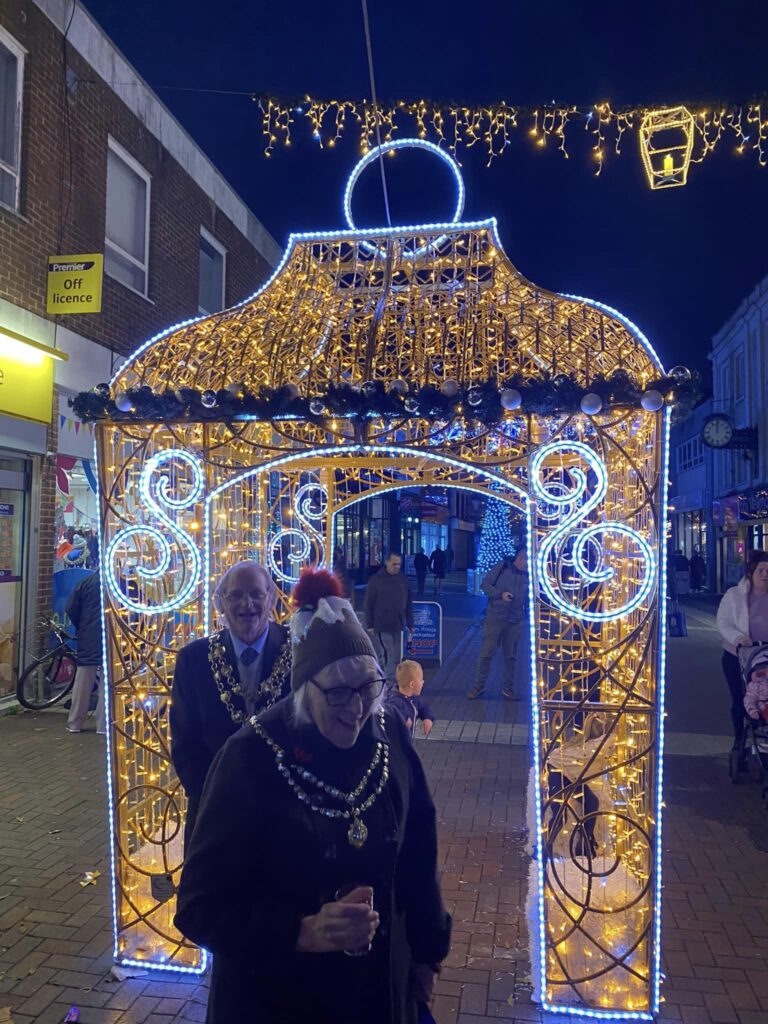 Mayor under a christmas arch